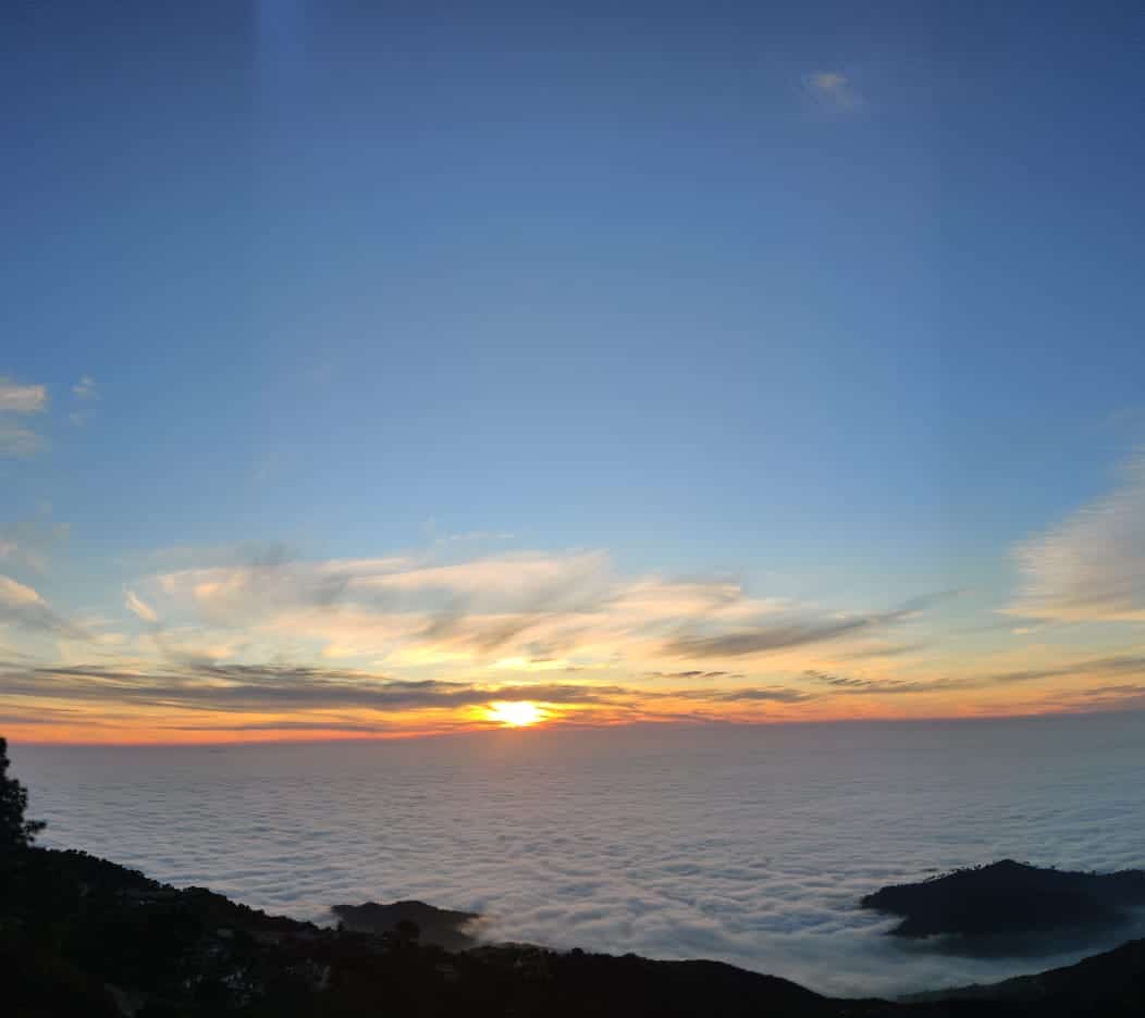 Clouds below Kasauli hill station during monsoon, showing elevation above the plains